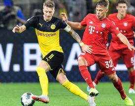 Reus und Kimmich sind Führungsspieler in der Nationalmannschaft. Am Wochende spielen sie gegeneinander.